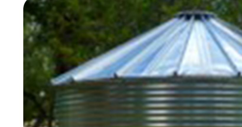 An Aqualine metal water storage tank with a standing-seam architectural roof